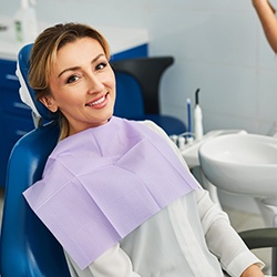 Cheerful patient in dental treatment chair