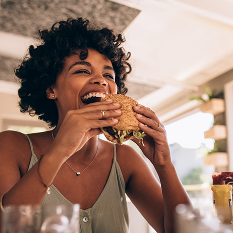 Woman about to eat a burger