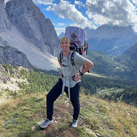 Dr. Mickle with a backpack about to go hiking