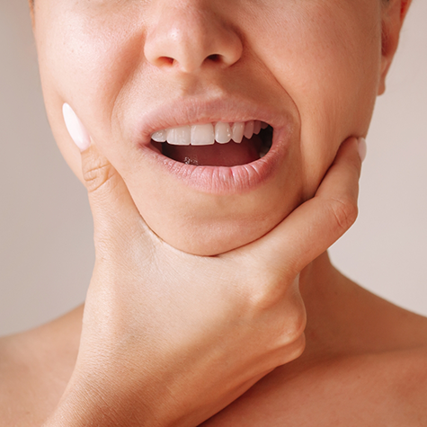 Rubbing jaw in pain in need of TMJ treatment in Greenwood Village