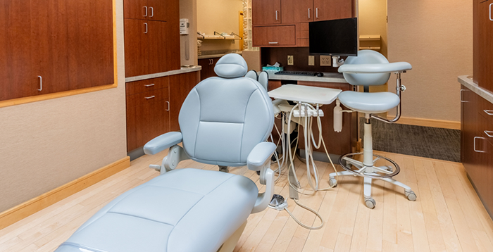 Dental chair in treatment area viewed from the front